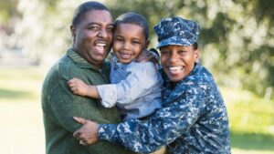 Navy female with husband and child, military financial education